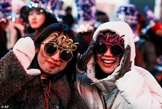 Thousands Gather in Times Square for New Year's Eve Celebration as 2025 Begins